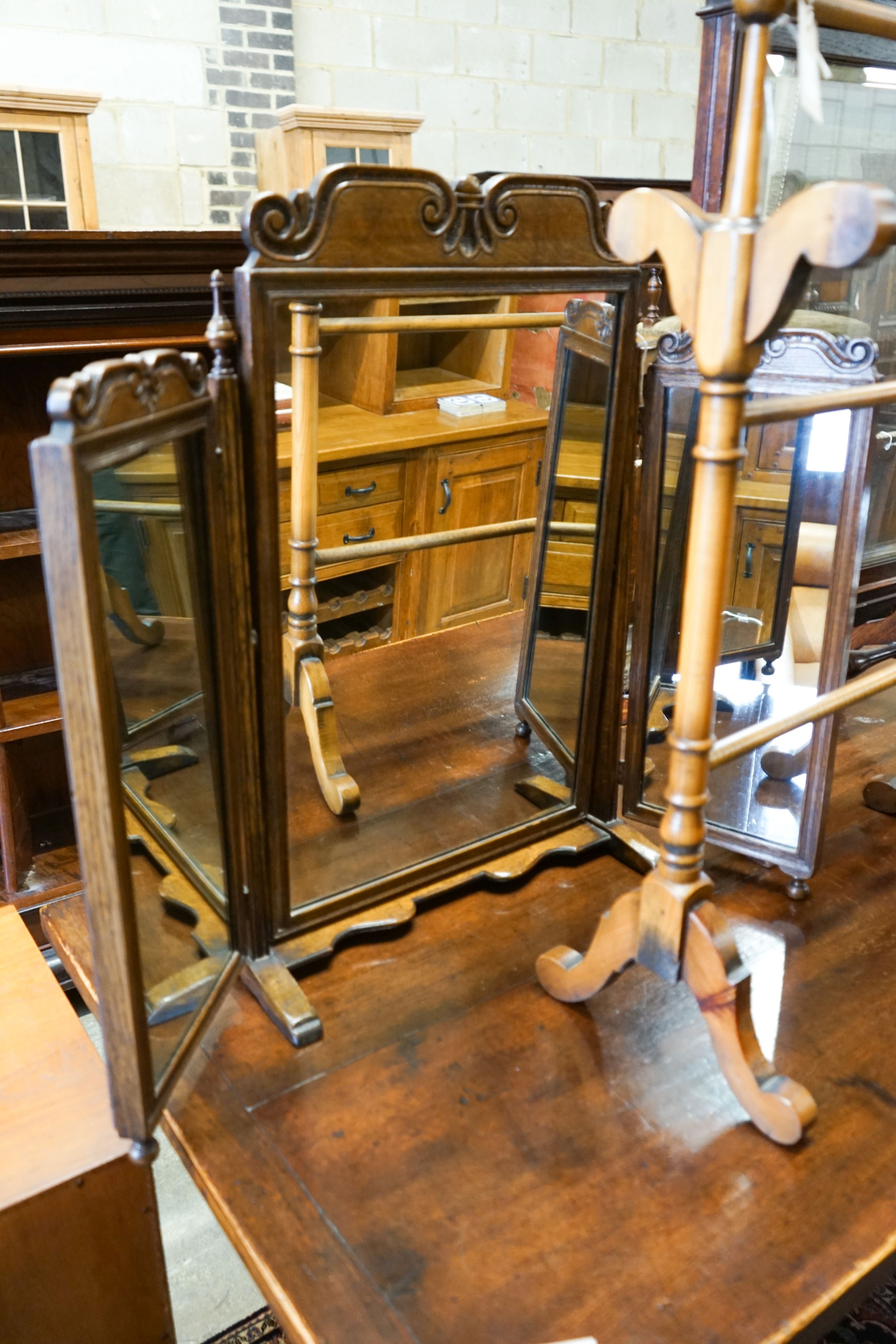 An oak triple mirror, a towel rail, an oak firescreen and two toilet mirrors